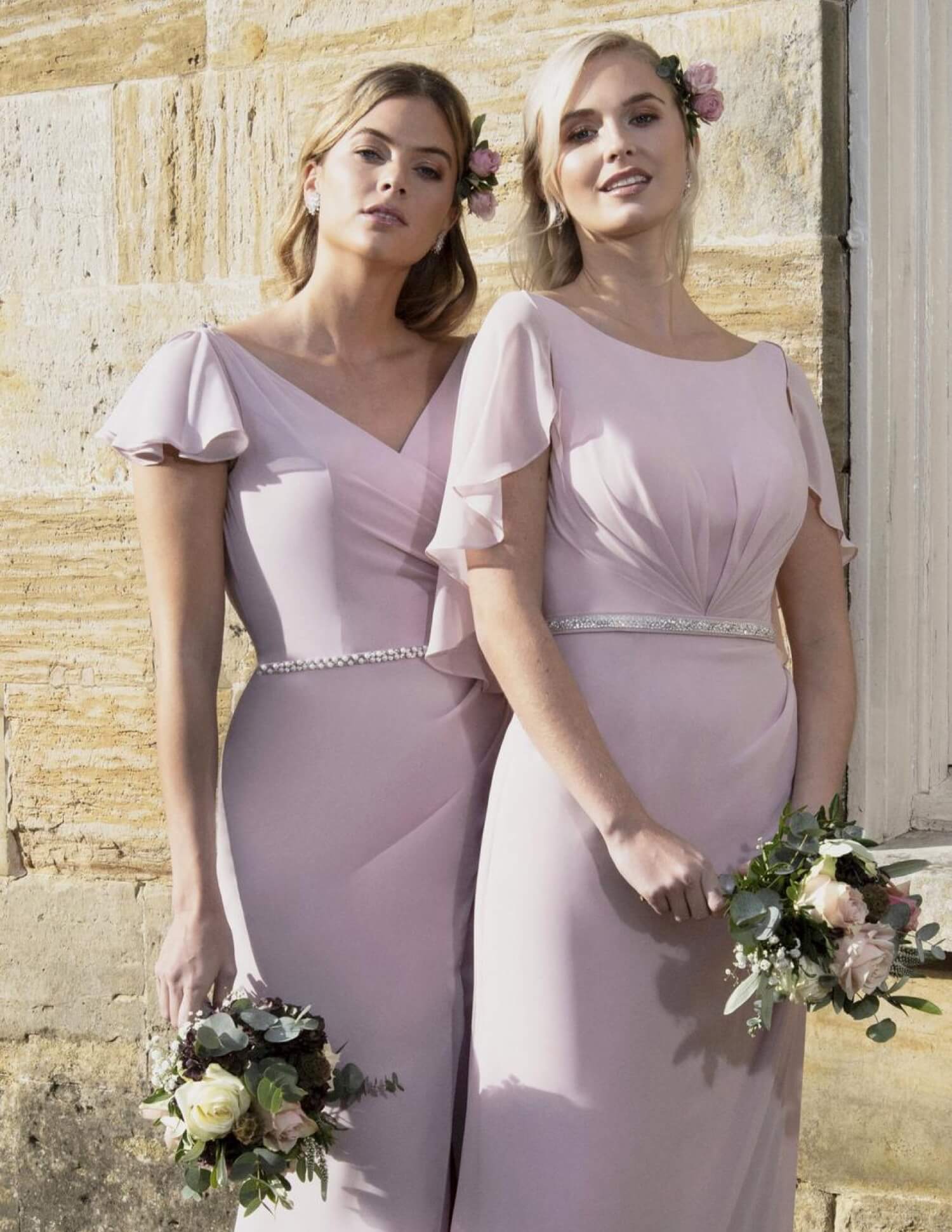 Bridesmaids wearing pale pink dresses