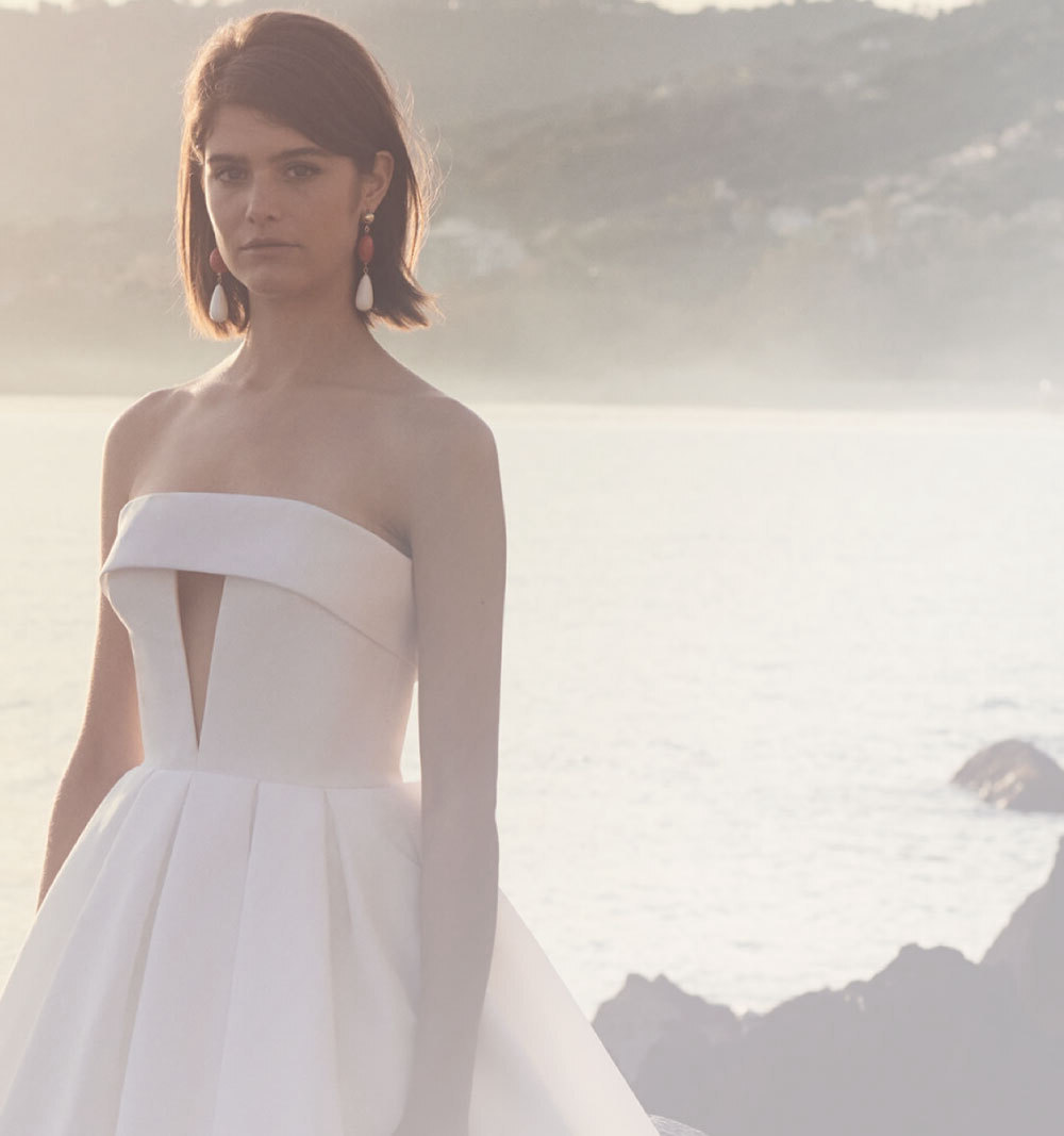 Model wearing a white evening dress - Mobile Image